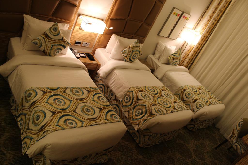 Quarto Deluxe com 3 Camas Individuais